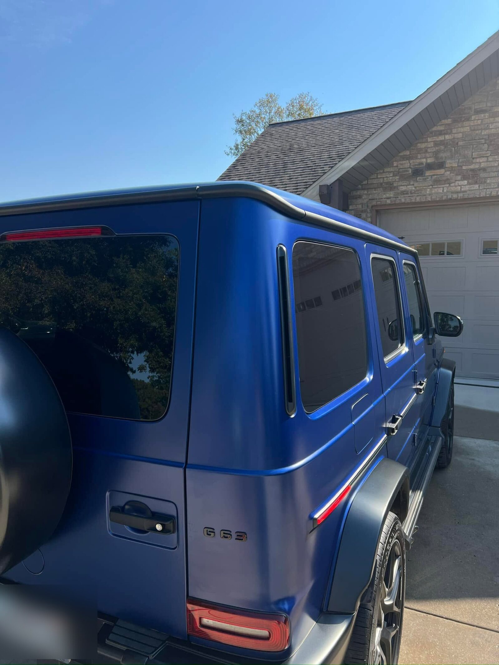 A deep blue Mercedes-AMG G63 detailed by Ozark Details